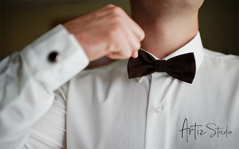 Man fixing his bowtie